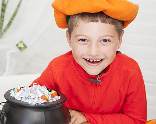 Boy smiling with his Halloween Candy