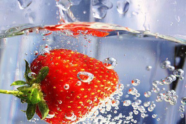 Strawberry in a glass of water