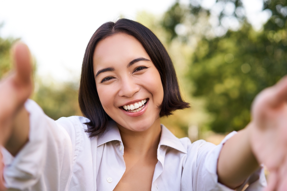 Woman having a dental checkup with a mirror and probe