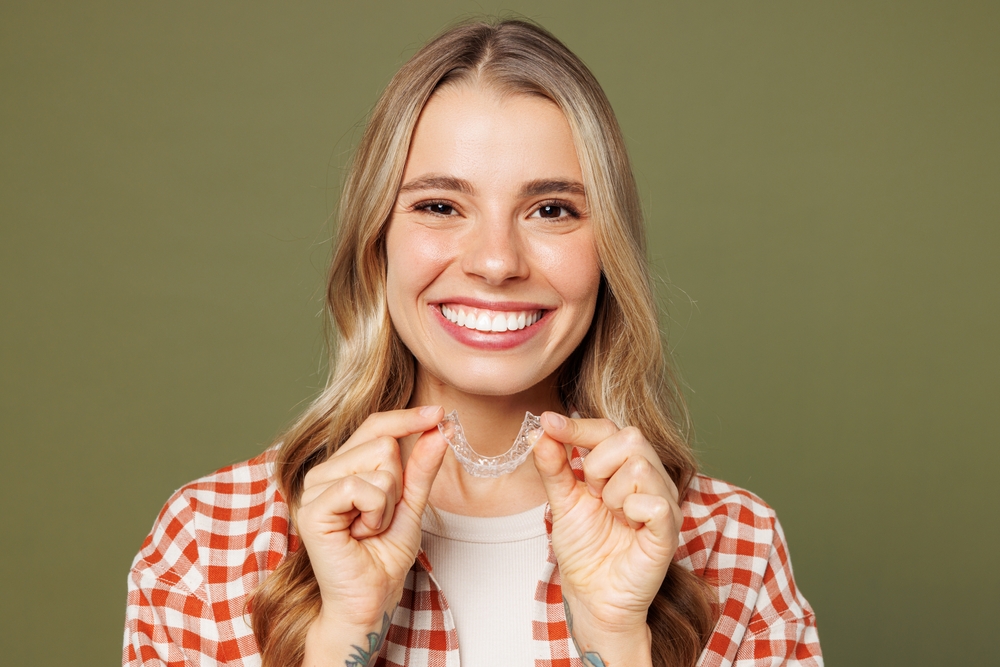 Woman having a dental checkup with a mirror and probe